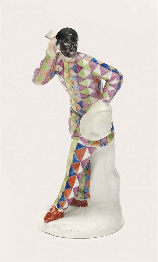 A KLOSTER VEILSDORF FIGURE OF HARLEQUIN