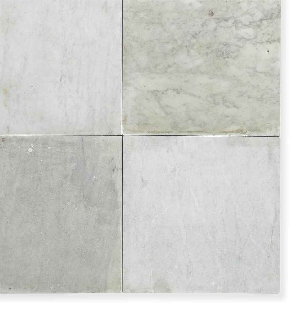 A QUANTITY OF WHITE MARBLE FLOOR TILES