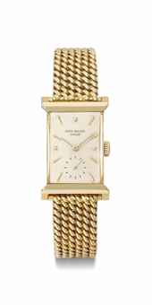 Patek Philippe. A fine and rare 18K gold rectangular wristwatch with bracelet 