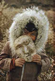 A Nunamiut Boy and Mask, Alaska, c. 1958  