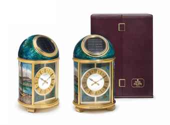 Patek Philippe. A Fine and Unique Gilt Brass Solar-Powered Desk Clock with Cloisonné Sail Boat Motif and Original Presentation Box 