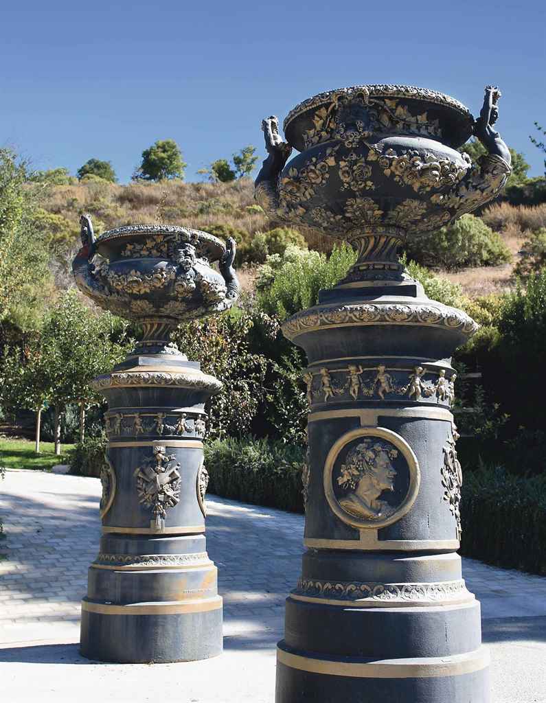 A LARGE PAIR OF FRENCH PARCEL-GILT AND BLACK-PAINTED CAST-IR...