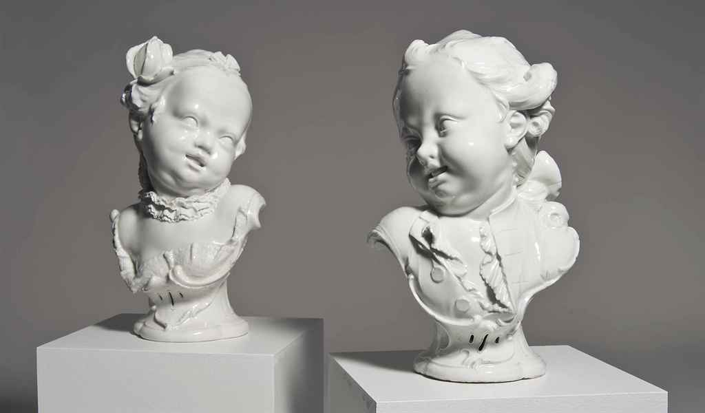 A PAIR OF NYMPHENBURG WHITE BUSTS OF CHILDREN