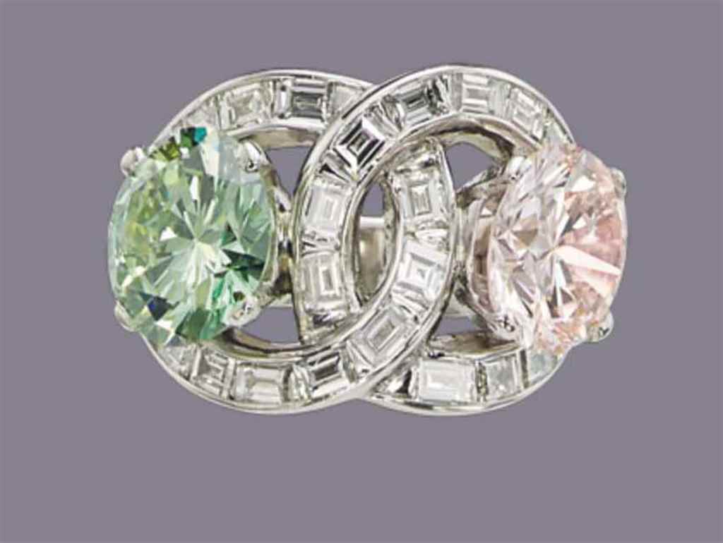 A COLOURED DIAMOND AND TREATED COLOURED DIAMOND 'TOI ET MOI'...