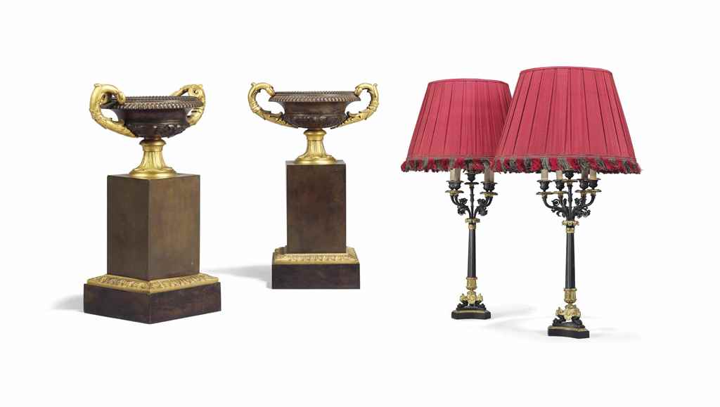 A PAIR OF REGENCY STYLE ORMOLU AND PATINATED BRONZE FOUR-LIG...