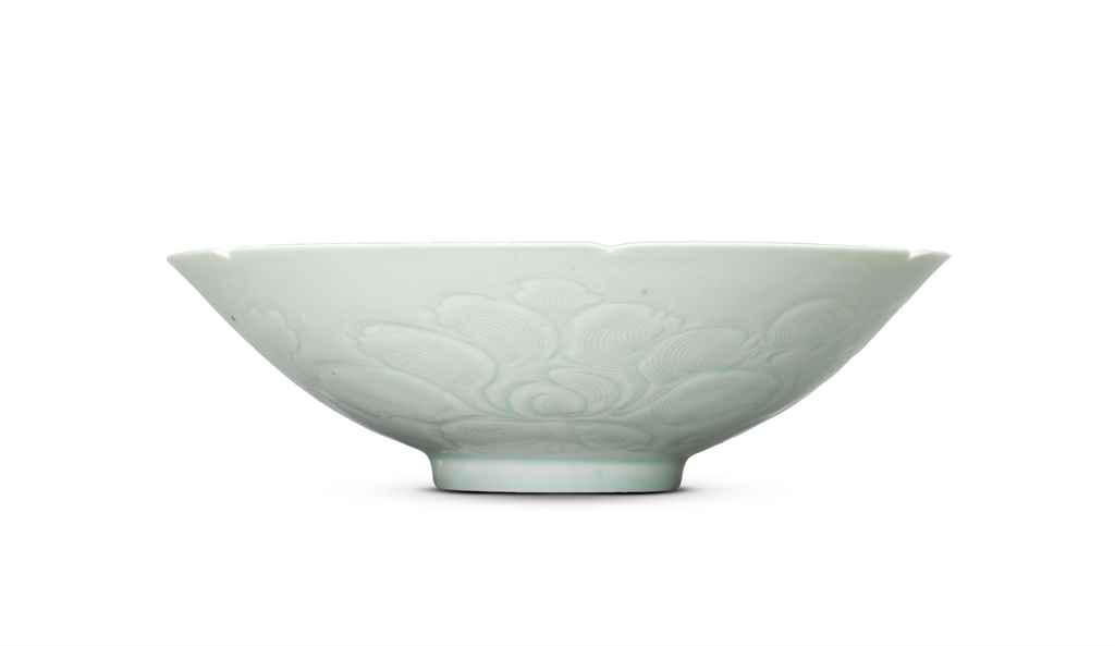 A RARE CARVED QINGBAI FOLIATE 'CHILONG' BOWL