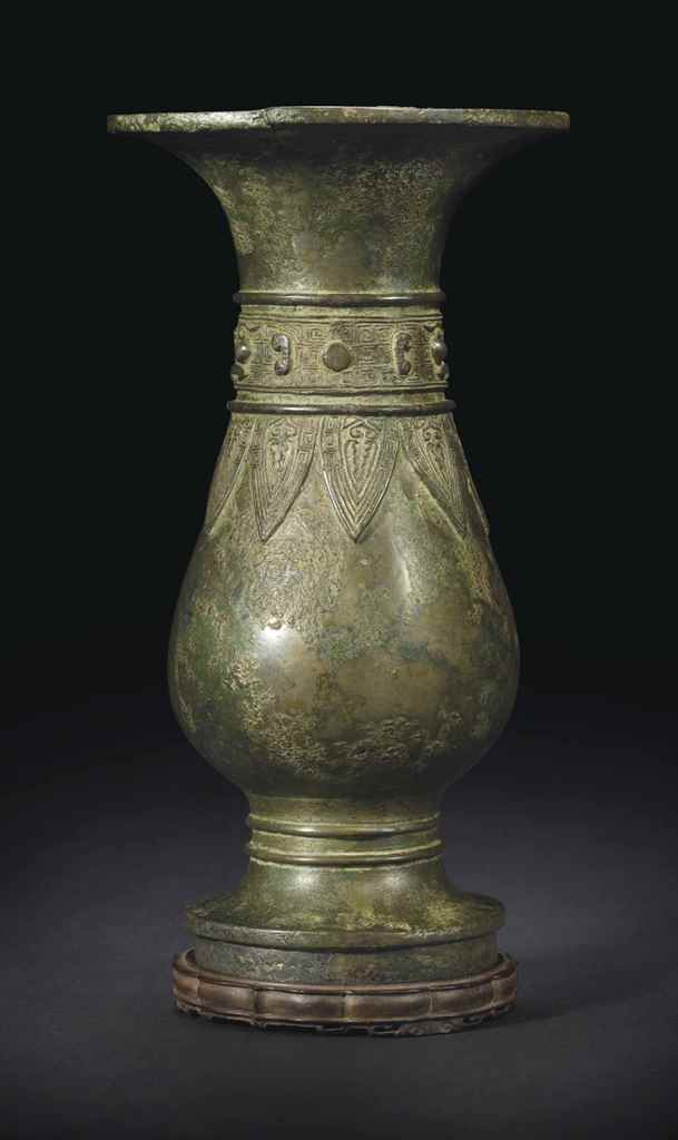 AN ARCHAISTIC BRONZE FLOWER VASE , QING DYNASTY (16441911) Christie's