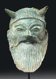 AN ETRUSCAN BRONZE MASK OF ACHELOOS  