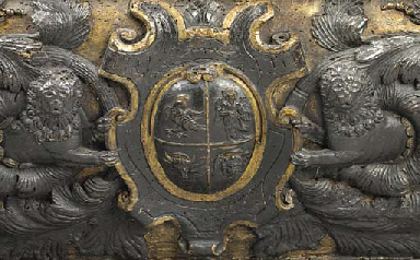 AN ITALIAN EBONISED AND PARCEL-GILT WALNUT CASSONE  