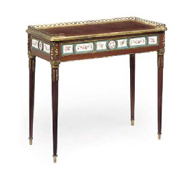 A LOUIS XVI ORMOLU AND PORCELAIN-MOUNTED MAHOGANY TABLE A EC...