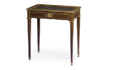 A FRENCH MAHOGANY AND PLUM PUDDING MAHOGANY BIJOUTERIE TABLE...