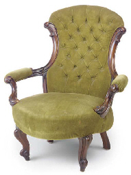 A MID VICTORIAN WALNUT ARMCHAIR