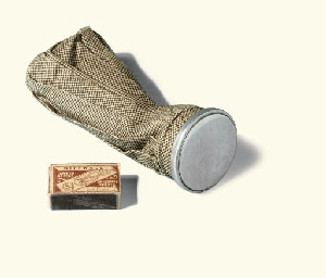 Amundsen's waterproof matchbox holder containing three matchboxes  