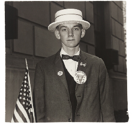 Boy with a straw hat waiting to march in a pro-war parade, N.Y.C. 1967  