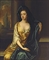 Portrait of a lady, traditionally identified as Frances Whitelocke (1614-1649), daughter of William, Lord Willoughby of Parham, three-quarter-length, in a yellow dress with a blue shawl, beside a column, a landscape beyond