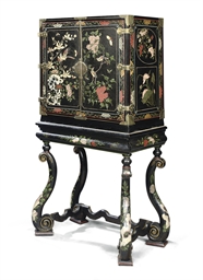 A WILLIAM III COROMANDEL LACQUER AND POLYCHROME-JAPANNED CABINET-ON-STAND 