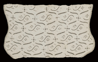 A FINE WHITEWORK AND NEEDLELACE COIF  