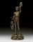 A FRENCH BRONZE FIGURE ENTITLED 'MARCHAND DES MASQUES'  