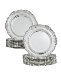 A FINE SET OF TWENTY-FOUR GEORGE III SILVER DINNER PLATES FR...