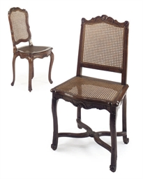 A REGENCE BEECHWOOD CANED SIDE CHAIR AND A VENETIAN WALNUT C...