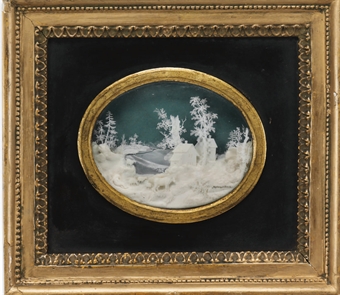 A CARVED IVORY RELIEF ON GLASS  