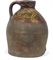 A MEDIEVAL SLIP-DECORATED WINE-VESSEL  