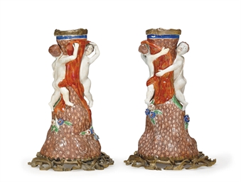 A PAIR OF ORMOLU-MOUNTED PUTTI STANDS