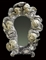 A SOUTH GERMAN PAINTED AND SILVERED MIRROR  