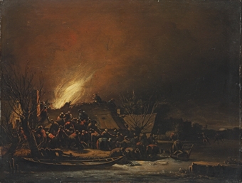 A fire in a village at night