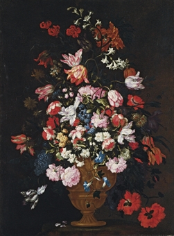Roses, tulips, lilies and other flowers in a bronze urn on a stone socle