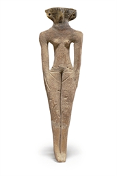 AN EGYPTIAN TERRACOTTA CONCUBINE FIGURE