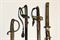 A JAPANESE SHORT KATANA IN MILITARY MOUNTS; TWO BRITISH AND ONE FRENCH REGULATION SWORDS 