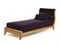 A VELVET UPHOLSTERED WALNUT DAYBED,  