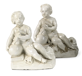 A very rare pair of Weesp figures of seated boys