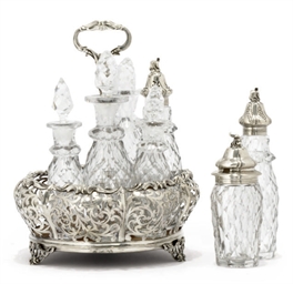 AN EARLY VICTORIAN SILVER SEVEN-BOTTLE CRUET STAND