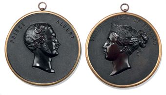A PAIR OF VICTORIAN BOIS DURCI PORTRAIT PLAQUES OF QUEEN VICTORIA AND PRINCE ALBERT 
