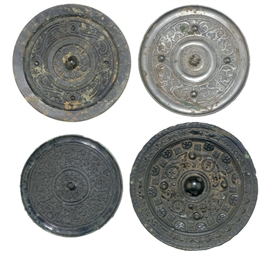 A GROUP OF FOUR BRONZE MIRRORS, HAN DYNASTY (206 BC-AD 220) ...