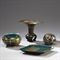 ENSEMBLE DE QUATRE OBJETS EN BRONZE ET EMAUX CHAMPLEVES 