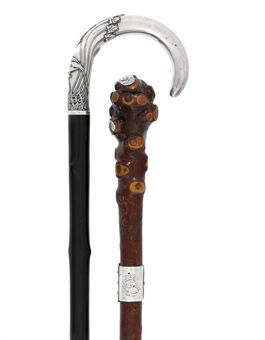 [FREUD, Sigmund (1856-1939)]. Two canes reputedly owned by Freud: the first an ebony walking stick, the Austrian silver handle decorated with scrolling foliate tendrils (lacking metal ferrule), early twentieth century; the second a fruitwood cane, the rootwood knopped terminal with shaped silver mounts, the stem with a silver buckle clasp engraved with interlaced initials SF (lacking ferrule), the silver buckle indistinctly marked TD [perhaps Thomas Davies Junior], Birmingham, 1893. Provenance: Sigmund Freud (by repute; the 'SF' monogram corresponds with artefacts at the Freud Museum in London); Freud's niece (the daughter of his half-brother Philipp), Pauline Hartwig (1873-1951) -- described during her lifetime as having belonged to her uncle; acquired at posthumous sale of her widower, Frederick (d.18 January 1958), at The Bend, Thorley Lane, Timperley, Cheshire, in 1960; by descent to present owners.	 (2)