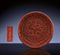 AN EXTREMELY RARE MING CINNABAR LACQUER 'DRAGON' CIRCULAR DISH