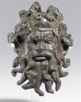A ROMAN BRONZE SILENUS MASK APPLIQUÉ  