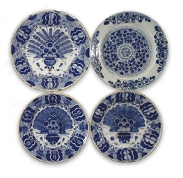 Three Dutch Delft blue and white peacock dishes and a blue a...