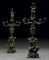 A PAIR OF FRENCH PATINATED BRONZE NINE-LIGHT CANDELABRA (CANDELABRES A NEUF LUMIERES, DECORES DE SIX FIGURES, MASCARONS ET CHIMERES)