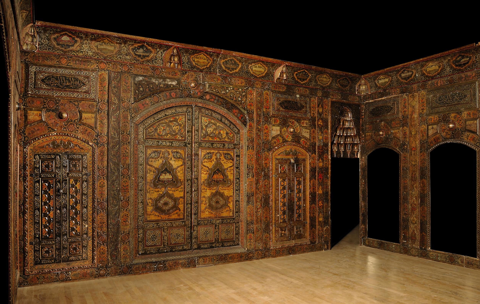 A POLYCHROME PAINTED AND RELIEF CARVED DAMASCUS ROOM SYRIA, DATED AH