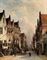 Figures in a sunlit town