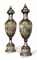 A PAIR OF MONUMENTAL VIENNA STYLE PORCELAIN COBALT-BLUE GROUND VASES AND COVERS, 'EIN BACCHANEL' AND 'EIN BACCHANTENZUG'