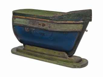 CARVED AND PAINTED WOOD CHANDLER'S SHOP-SIGN IN THE FORM OF A BOAT