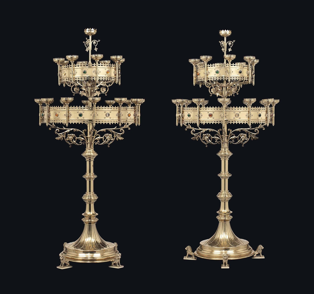 A LARGE PAIR OF VICTORIANGOTHIC BRASS FLOORSTANDING CANDELABRA