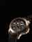 CORUM. A RARE, UNUSUAL AND LARGE 18K PINK GOLD LIMITED EDITION SEMI-SKELETONISED MINUTE REPEATING TOURBILLON WRISTWATCH