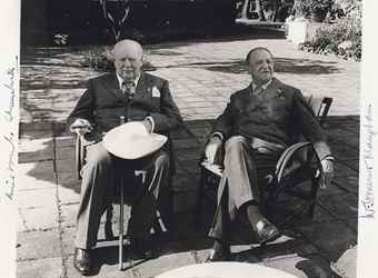 CHURCHILL, Winston S. and MAUGHAM, Somerset. Photograph signed (Winston S. Churchill and W. Somerset Maugham). Associated Press photo, black and white, 6 x 8in., n.d., ca. 1960, signed along left and right margins.